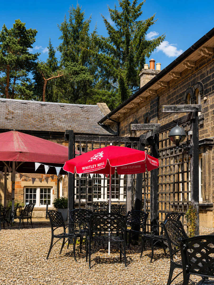 Courtyard seating beside the stone tea-room building